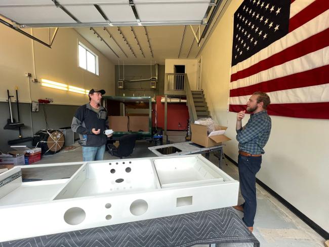 OREC Director Conor Hall meets with a business owner in the outdoor recreation industry.