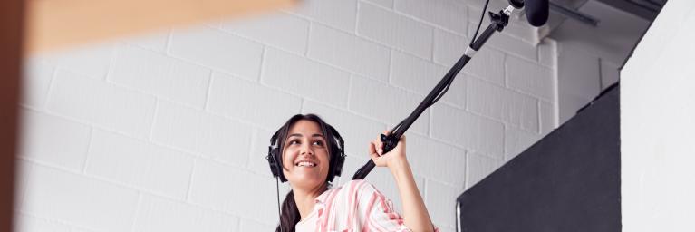 girl holding boom mike