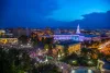 The Denver City & County building glows blue as a crowd gathers for Independence Day celebrations.