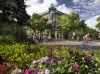 Bicyclists pass through old town Fort Collins on a summer day.