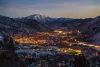 City of Glenwood Springs lit up on a winter night from above.