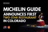 Promotional image featuring a gourmet dish, announcing the first Michelin Guide two-star restaurant in Colorado, highlighted by a dark background with the OEDIT and Colorado Tourism Office logos at the top.
